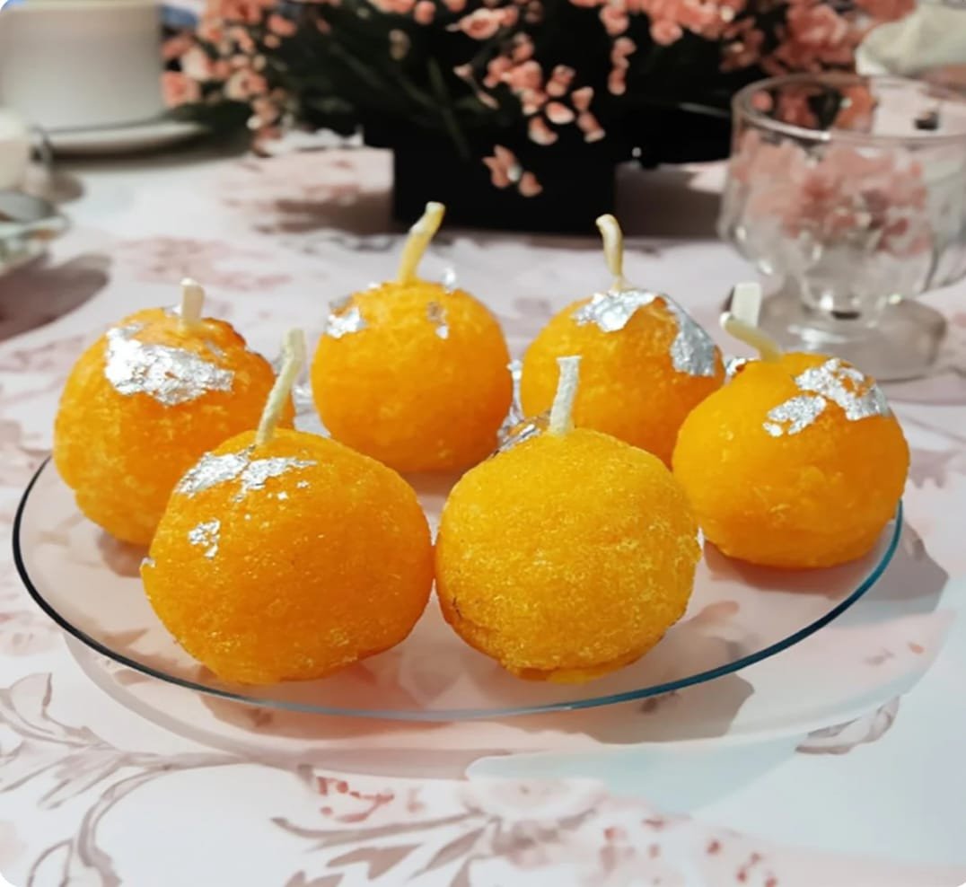 Laddu, besan k laddu, kaju katri, motichoor laddu Candle